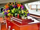 a colorful casket in a hearse or chapel before funeral or burial at cemetery