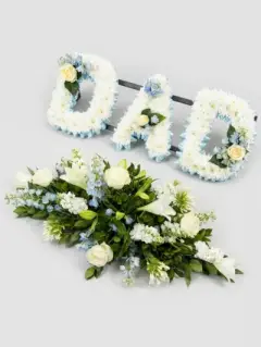 Dad with white and blue flowers and coffin spray duo sidcup