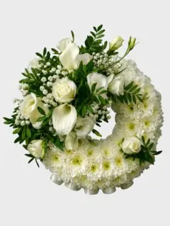 wreath ring with white roses and lilies from your sidcup florist