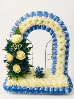 Gates of heaven with blue and white flowers funeral tribute for a loved one sidcup florist
