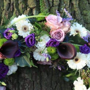 Sympathy wreath in white and purple dartford florist