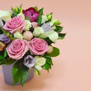 Flower composition in a stylish hat box dartford florist