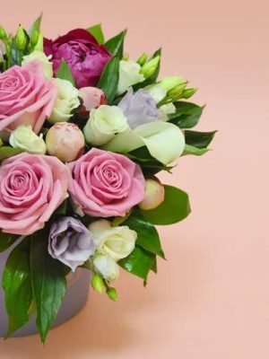 Flower composition in a stylish hat box dartford florist