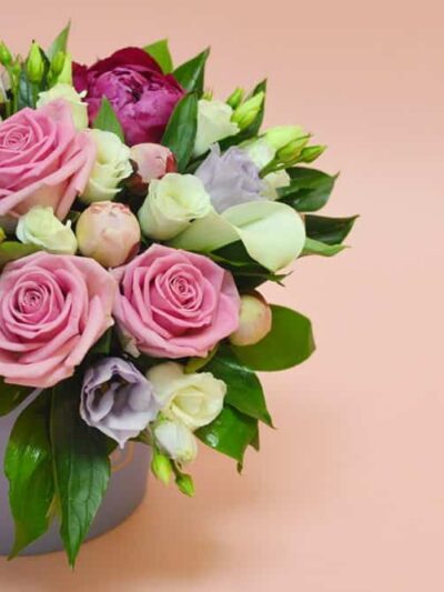 Flower composition in a stylish hat box dartford florist