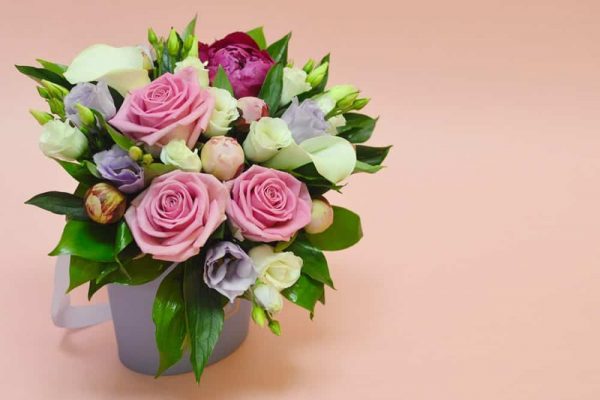 Flower composition in a stylish hat box dartford florist