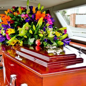 a colorful casket in a hearse or chapel before funeral or burial at cemetery