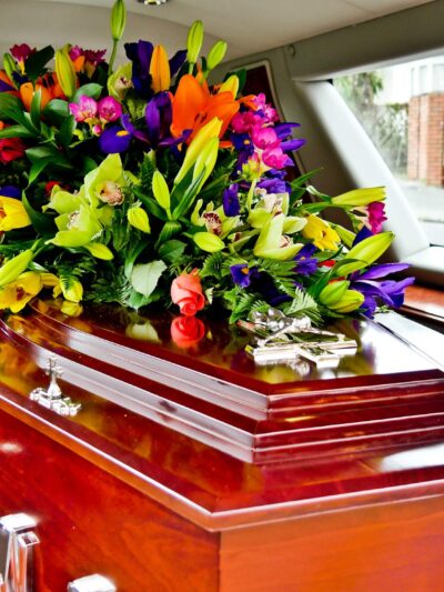 a colorful casket in a hearse or chapel before funeral or burial at cemetery